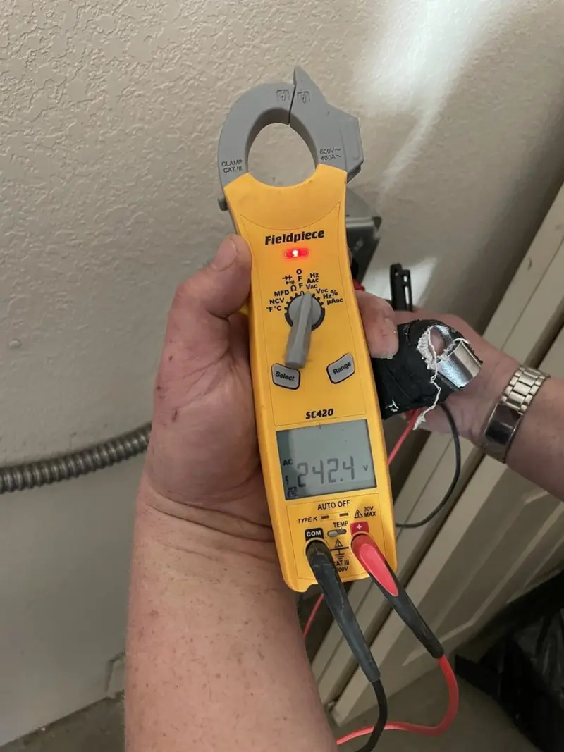 Voltage testing with clamp meter during Circuit Breaker Repair in Glen Cove
